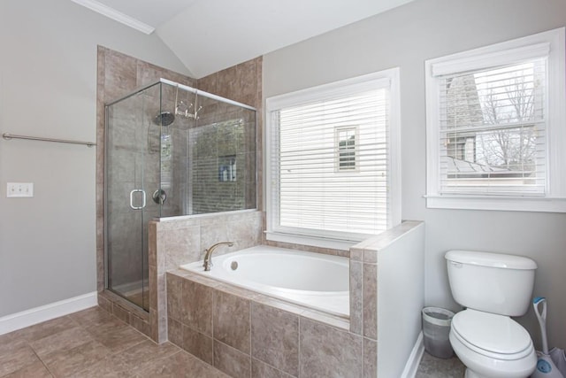 bathroom with a garden tub, vaulted ceiling, a shower stall, and baseboards