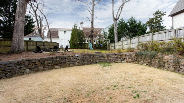 view of yard with a fenced backyard