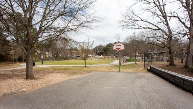 view of sport court with community basketball court and a lawn