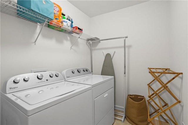 laundry area with washing machine and dryer and laundry area