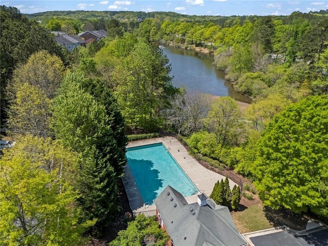 bird's eye view with a forest view and a water view