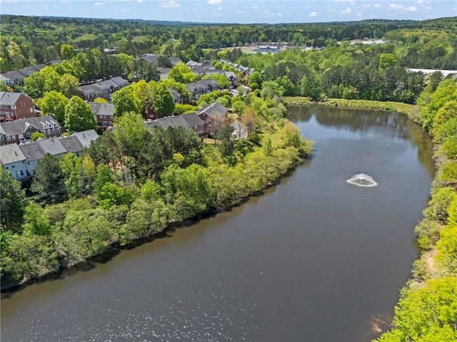 aerial view featuring a water view and a view of trees