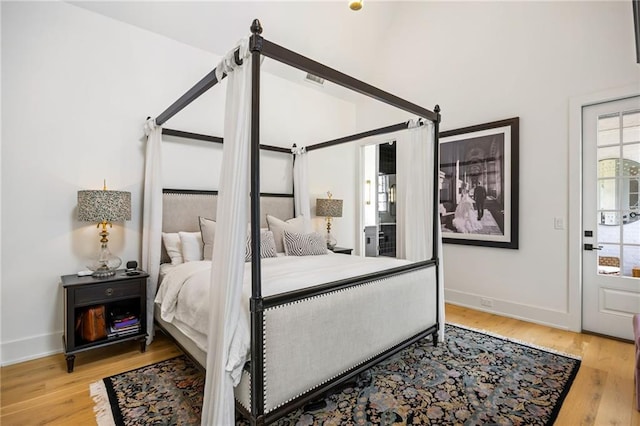 11277 Serenbe Ln, Chattahoochee Hills, GA 30268 - bedroom with wood finished floors and baseboards