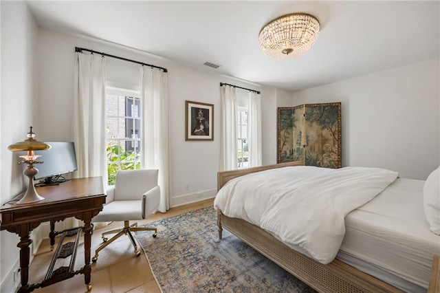 11277 Serenbe Ln, Chattahoochee Hills, GA 30268 - bedroom with a chandelier, a desk, and baseboards