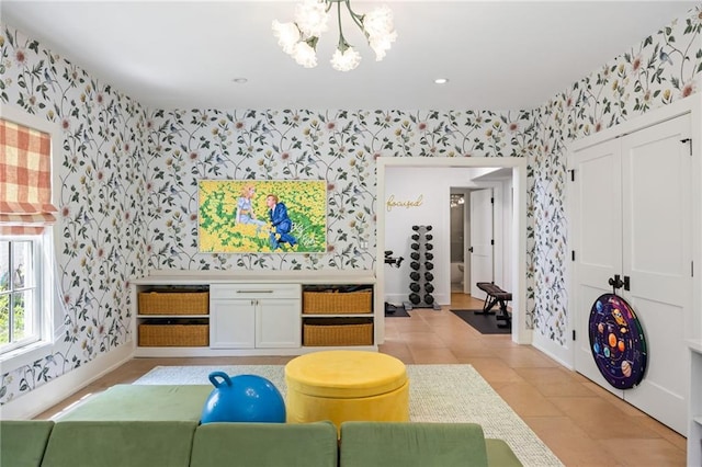 11277 Serenbe Ln, Chattahoochee Hills, GA 30268 - living room featuring wallpapered walls, a chandelier, baseboards, and light tile patterned flooring