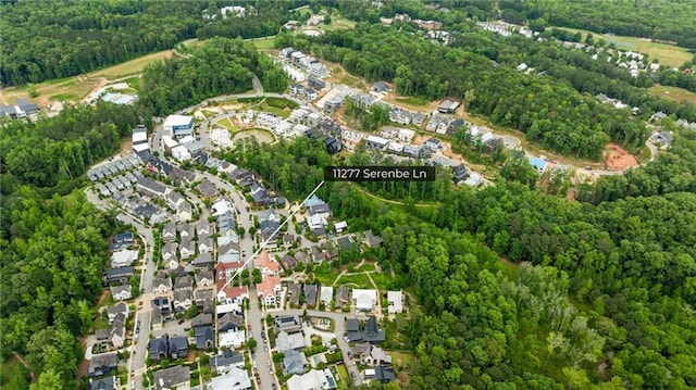 11277 Serenbe Ln, Chattahoochee Hills, GA 30268 - aerial view of property's location with nearby suburban area and a heavily wooded area