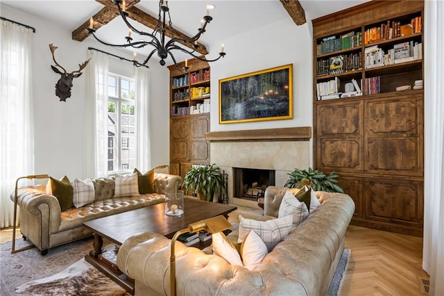 11277 Serenbe Ln, Chattahoochee Hills, GA 30268 - living room featuring a chandelier, beam ceiling, a high end fireplace, and built in shelves