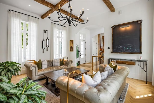 11277 Serenbe Ln, Chattahoochee Hills, GA 30268 - living area with arched walkways, beam ceiling, a chandelier, recessed lighting, and baseboards