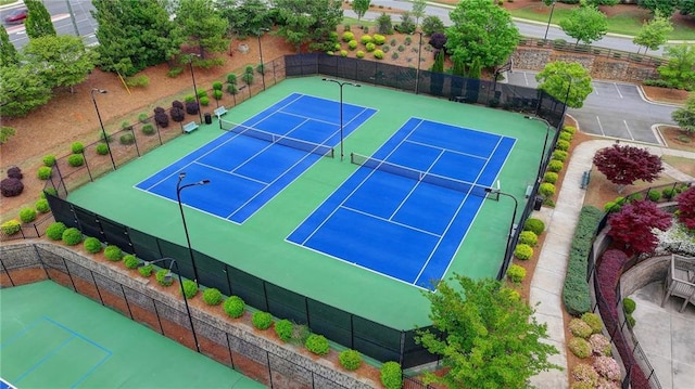 view of sport court with fence