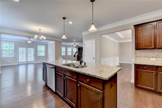 kitchen featuring a sink, ceiling fan with notable chandelier, and open floor plan