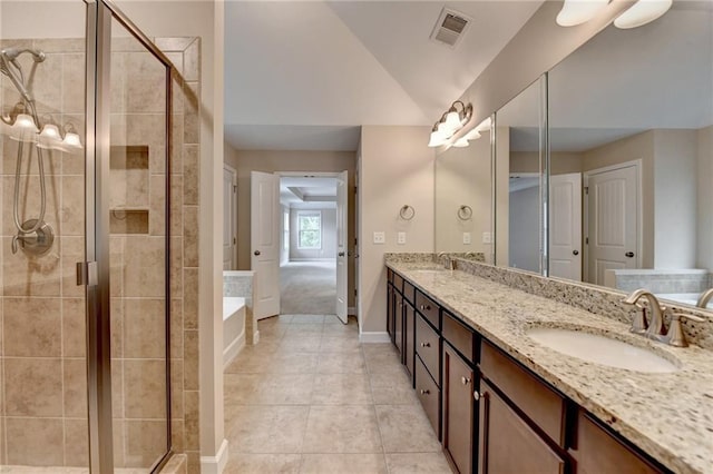 bathroom with a sink, tile patterned flooring, a stall shower, and visible vents