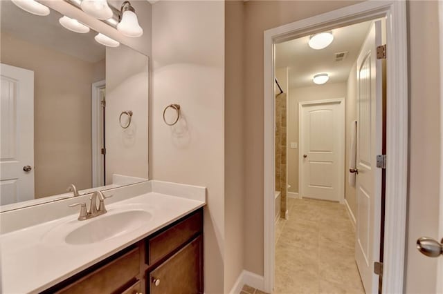 bathroom featuring vanity, tile patterned flooring, bathing tub / shower combination, and visible vents