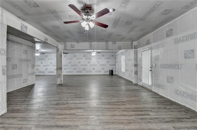 empty room featuring a ceiling fan and wood finished floors
