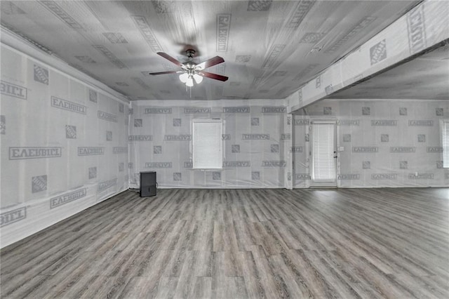 unfurnished living room featuring ceiling fan and wood finished floors