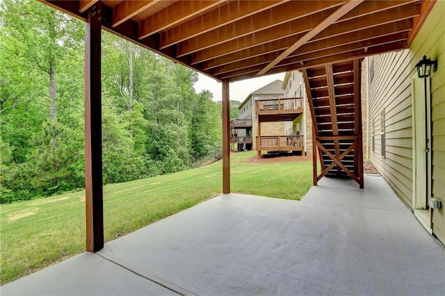 view of patio / terrace with a wooden deck and stairs