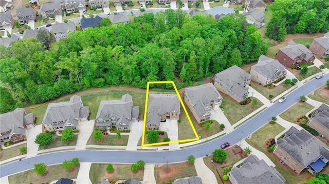 birds eye view of property with a residential view