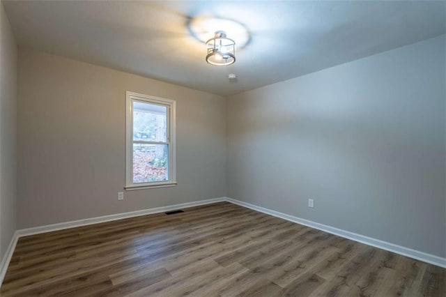 9 Woodberry Dr SE, Silver Creek, GA 30173 - empty room featuring wood finished floors and baseboards