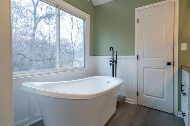 9 Woodberry Dr SE, Silver Creek, GA 30173 - full bathroom featuring a freestanding bath, vanity, and a wainscoted wall