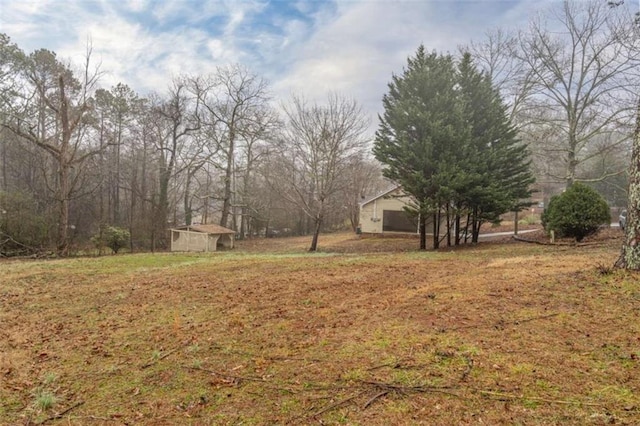 9 Woodberry Dr SE, Silver Creek, GA 30173 - view of grassy yard featuring an outbuilding