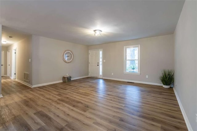 9 Woodberry Dr SE, Silver Creek, GA 30173 - unfurnished living room featuring wood finished floors and baseboards