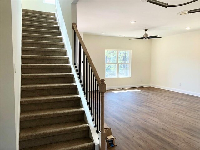 unfurnished dining area with a notable chandelier and dark wood-type flooring