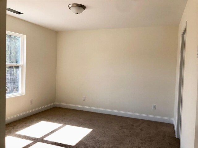 unfurnished bedroom with a closet and carpet flooring