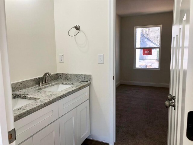 unfurnished bedroom featuring baseboards and light colored carpet