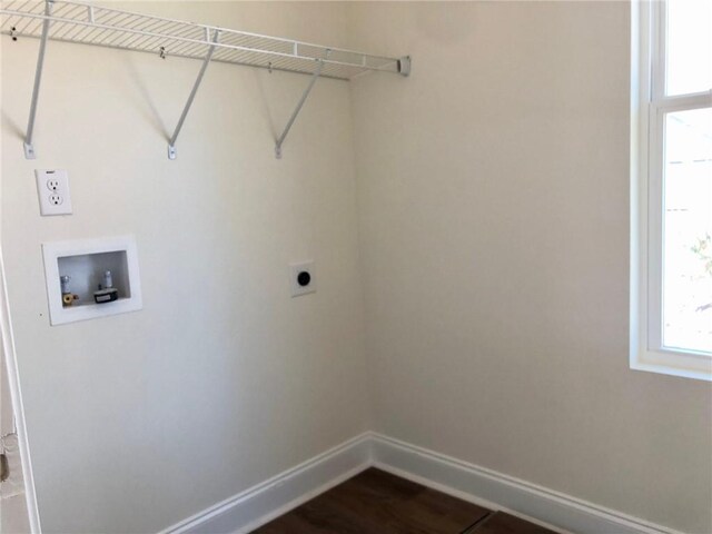 unfurnished bedroom with ceiling fan, a tray ceiling, light carpet, and connected bathroom