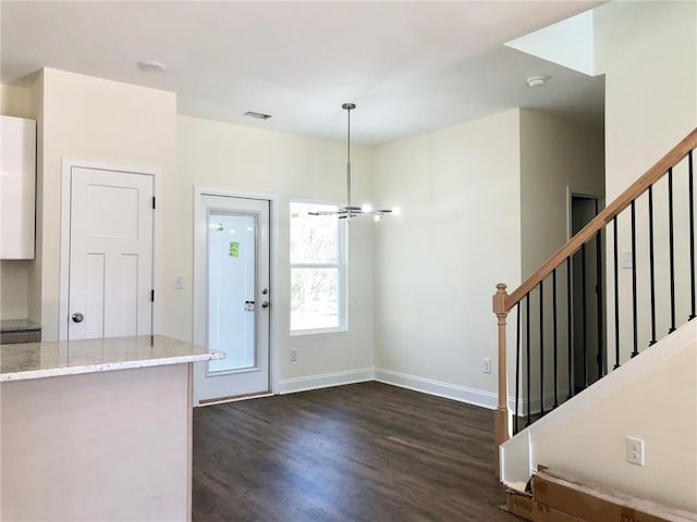 kitchen with light stone counters, recessed lighting, a sink, white cabinetry, and appliances with stainless steel finishes