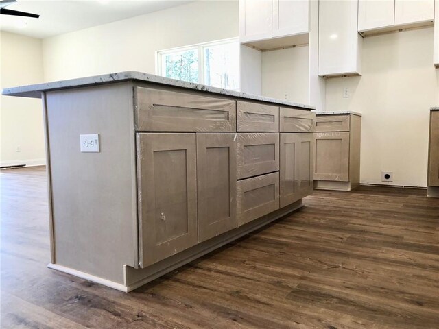 interior space featuring visible vents, dark wood finished floors, baseboards, and an inviting chandelier