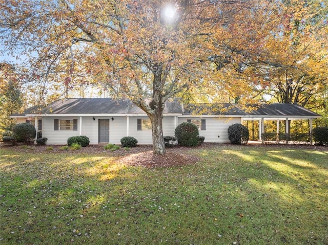 ranch-style home featuring a front yard