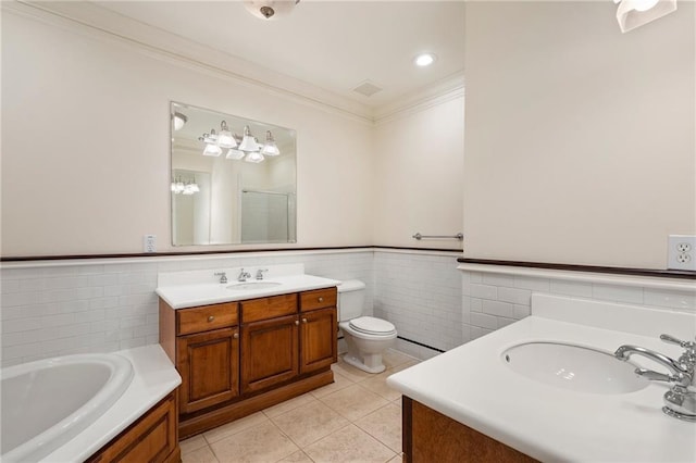 full bathroom featuring tile walls, tile patterned flooring, vanity, toilet, and crown molding