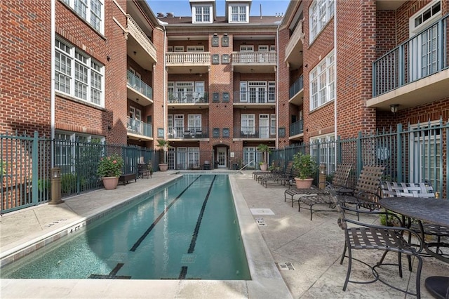 view of swimming pool with a patio area