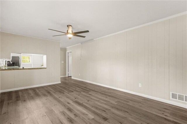4218 Hideaway Dr, Tucker, GA 30084 - unfurnished living room featuring visible vents, baseboards, ornamental molding, wood finished floors, and a ceiling fan