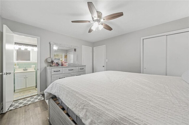 4218 Hideaway Dr, Tucker, GA 30084 - bedroom with a ceiling fan, ensuite bathroom, and wood finished floors