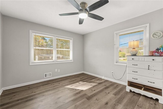 4218 Hideaway Dr, Tucker, GA 30084 - unfurnished bedroom with baseboards, visible vents, wood finished floors, and ceiling fan