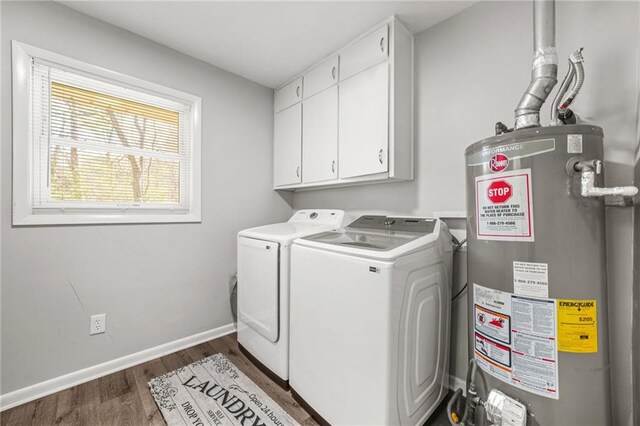 4218 Hideaway Dr, Tucker, GA 30084 - clothes washing area featuring baseboards, gas water heater, dark wood finished floors, cabinet space, and washer and clothes dryer