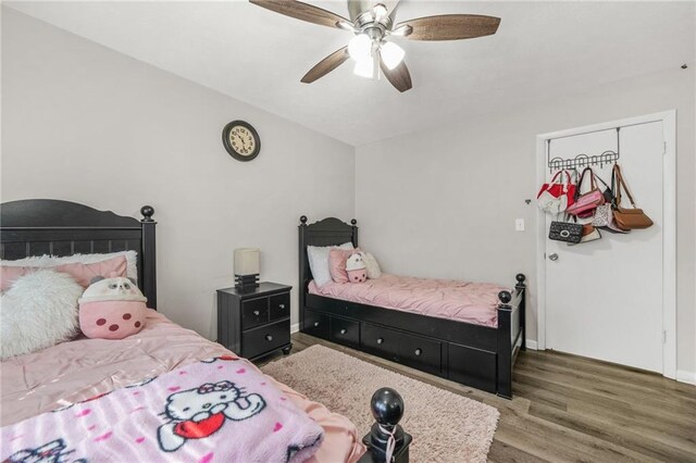 4218 Hideaway Dr, Tucker, GA 30084 - bedroom with baseboards, wood finished floors, and a ceiling fan