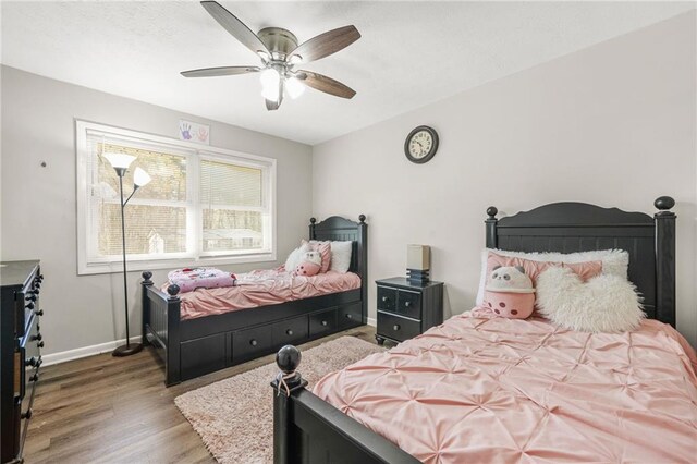4218 Hideaway Dr, Tucker, GA 30084 - bedroom with baseboards, ceiling fan, and wood finished floors