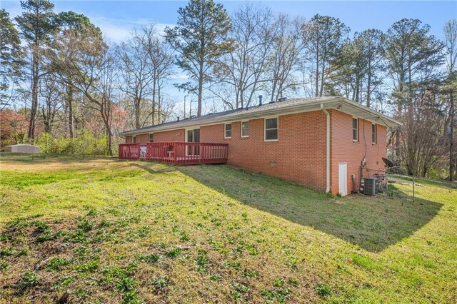 4218 Hideaway Dr, Tucker, GA 30084 - back of house featuring brick siding, a yard, and a wooden deck