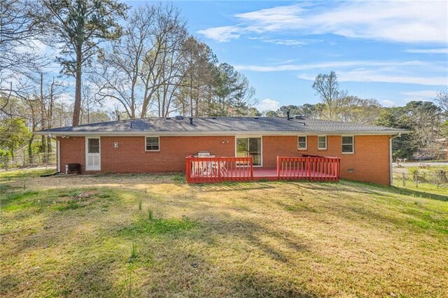 4218 Hideaway Dr, Tucker, GA 30084 - rear view of property with cooling unit, a wooden deck, fence, brick siding, and a yard