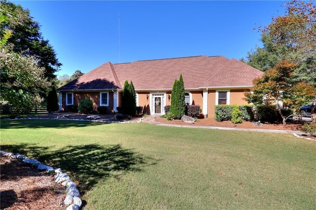 view of front facade with a front yard