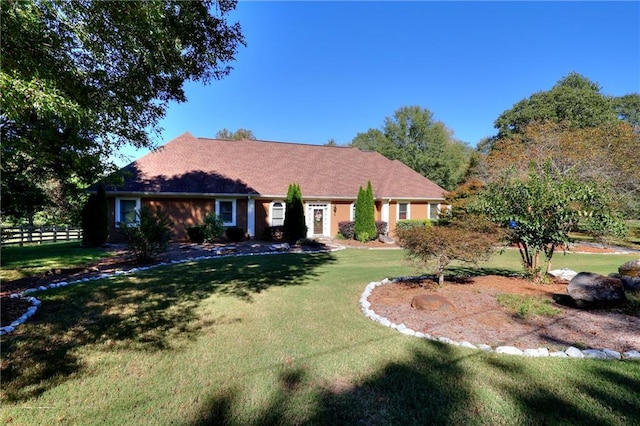 single story home featuring a front lawn