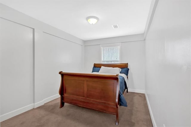 bedroom with light carpet