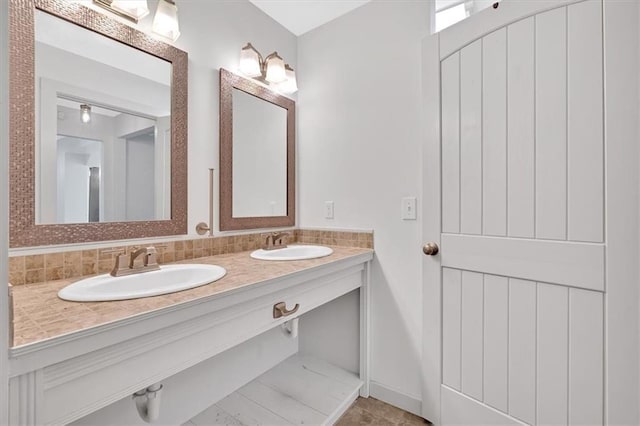 bathroom featuring vanity and decorative backsplash