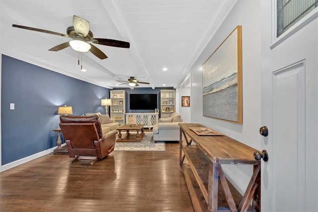 living room with beam ceiling, ceiling fan, dark hardwood / wood-style floors, and built in shelves