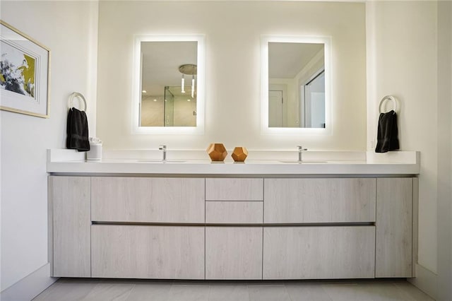 bathroom with vanity and tile patterned floors