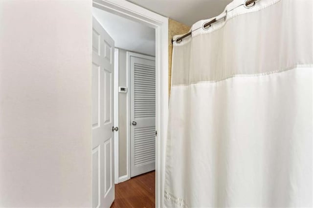 bathroom featuring wood finished floors