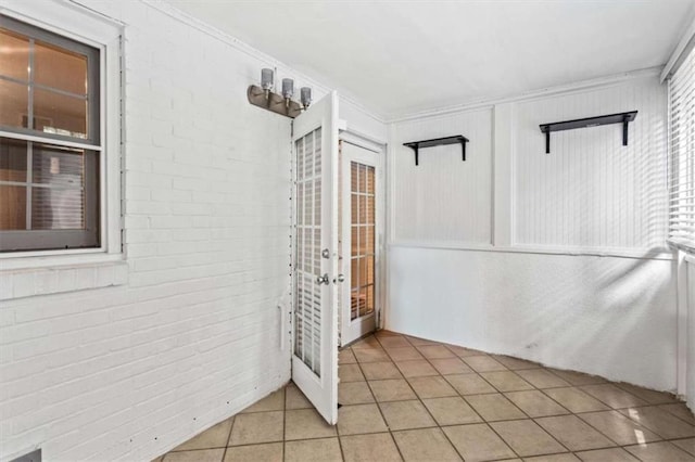 unfurnished sunroom featuring french doors