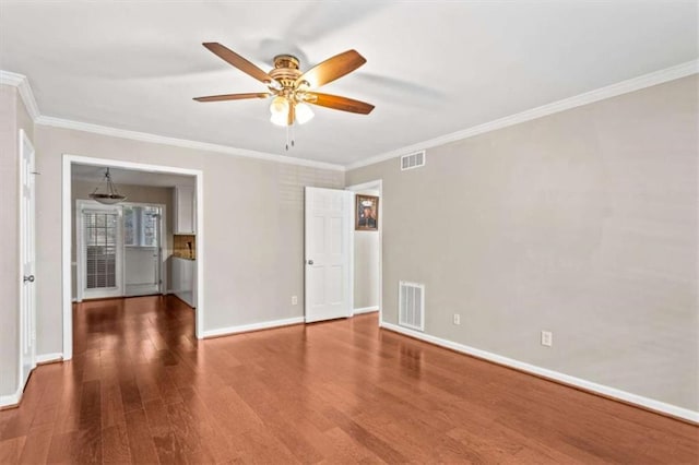 unfurnished bedroom with wood finished floors, baseboards, crown molding, and ceiling fan